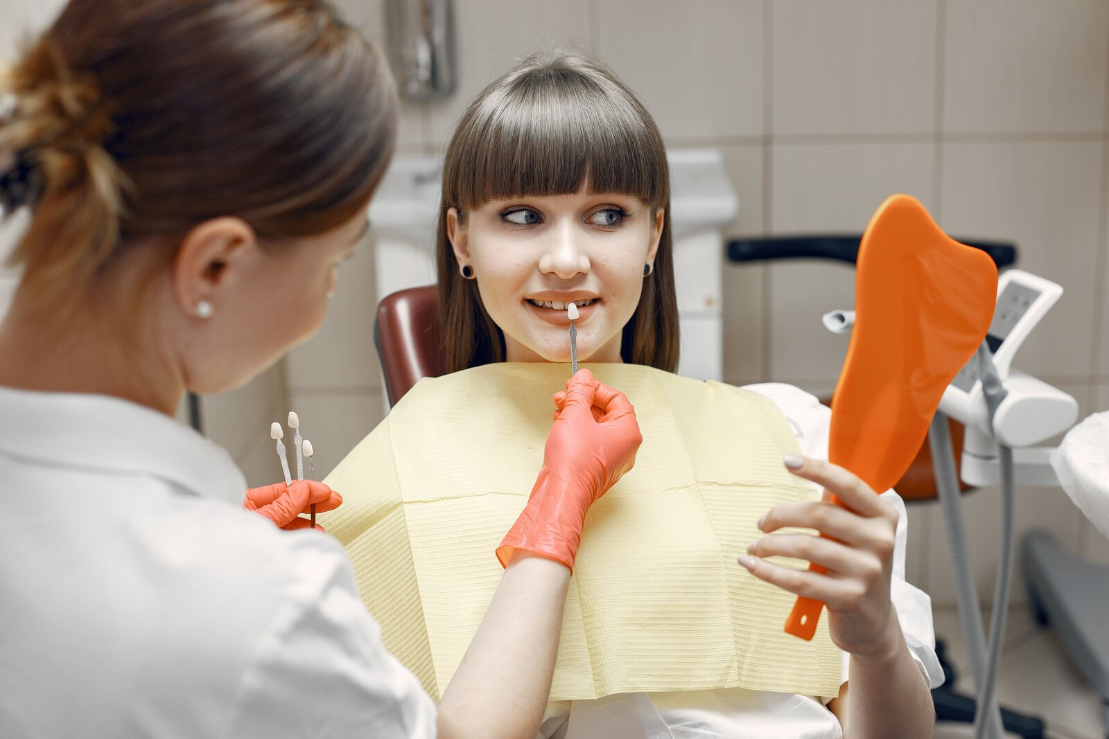A patient checking her smile